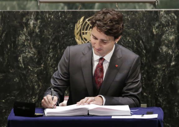 Justin Trudeau signs the Paris Climate Agreement at the U.N. headquarters in New York,  April 22, 2016.
