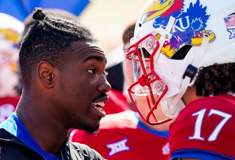 Kansas quarterback Jalon Daniels (6) talks with quarterback Jason Bean (17) after leaving the game with an injury during the second half against TCU at David Booth Kansas Memorial Stadium on Oct. 8, 2022.