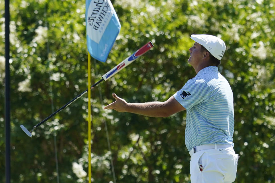 Bryson DeChambeau flips his putter after missing a par putt on the 17th hole during the final round of the Charles Schwab Challenge golf tournament at the Colonial Country Club in Fort Worth, Texas, Sunday, June 14, 2020. (AP Photo/David J. Phillip)