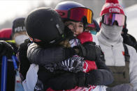 China's Eileen Gu hugs United States' Chloe Kim after Kim won a gold medal in the women's halfpipe finals at the 2022 Winter Olympics, Thursday, Feb. 10, 2022, in Zhangjiakou, China. (AP Photo/Francisco Seco)