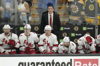 Carolina Hurricanes head coach Rod Brind'Amourin, top, and members of the team watch as the Hurricanes trail the Boston Bruins in the third period of Game 4 of an NHL hockey Stanley Cup first-round playoff series, Sunday, May 8, 2022, in Boston. (AP Photo/Steven Senne)