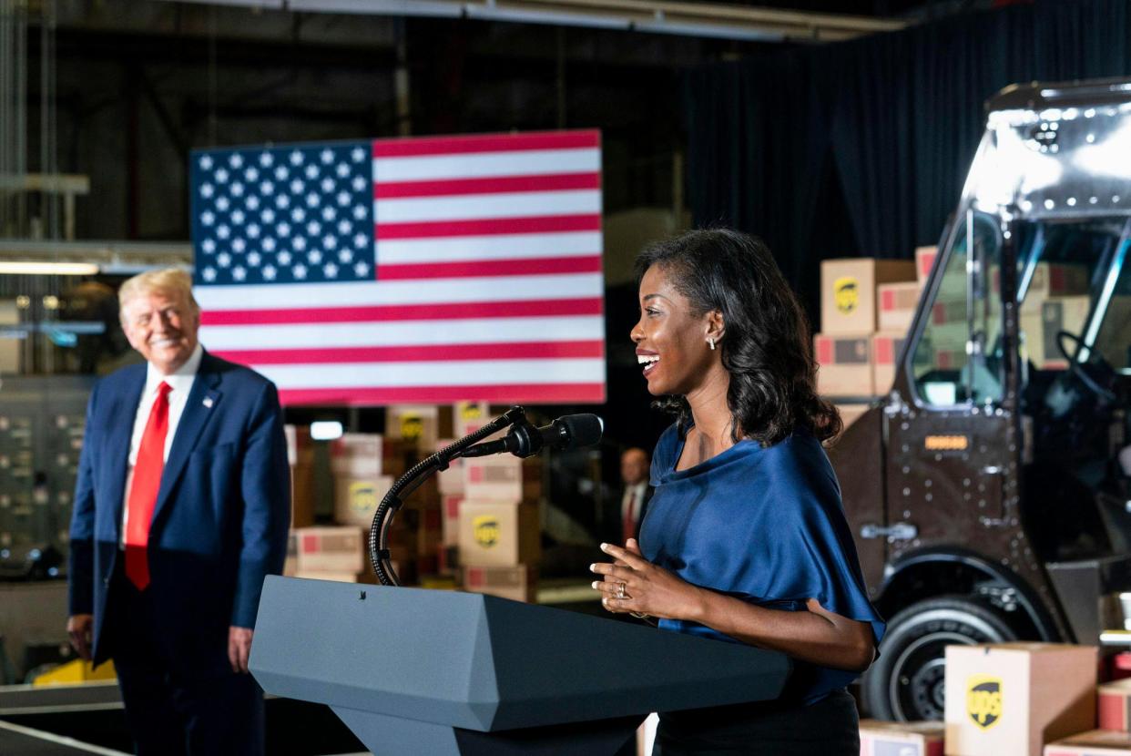 <span>Janelle King speaks alongside Donald Trump in Atlanta, Georgia, on 15 July 2020.</span><span>Photograph: Storms Media Group/Alamy</span>