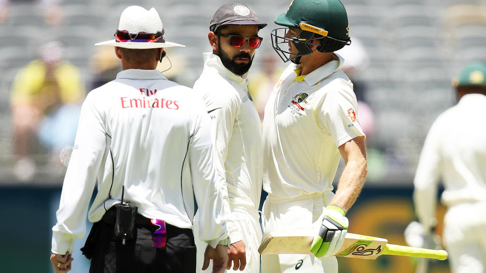 Virat Kohli and Tim Paine, pictured here in a bizarre clash during the second Test in 2018.