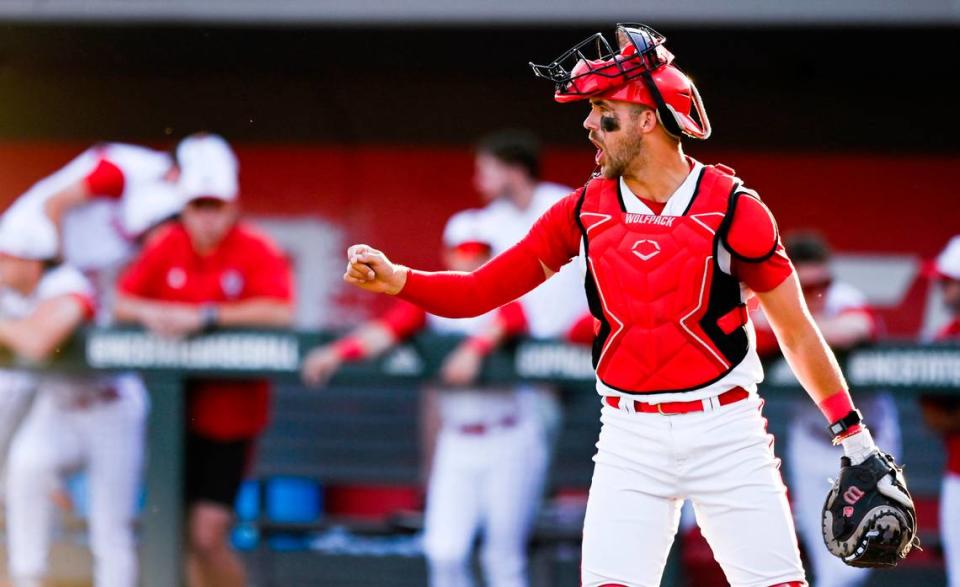 N.C. State’s Jacob Cozart (14) cheers after a strikeout during N.C. State’s 9-2 victory against Bryant in the NCAA Raleigh Regional at Doak Field on Friday, May 31, 2024.