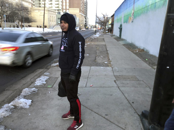 Javier Guillen, a Venezuelan immigrant, tries to figure out how to get to a shelter in Denver shortly after stepping off a bus from El Paso, Texas, on Friday, Jan. 6, 2023. Denver is reeling after nearly 4,000 immigrants, most of whom are Venezuelan, arrived from the border on their own during the past month. (AP Photo/Nicholas Riccardi)