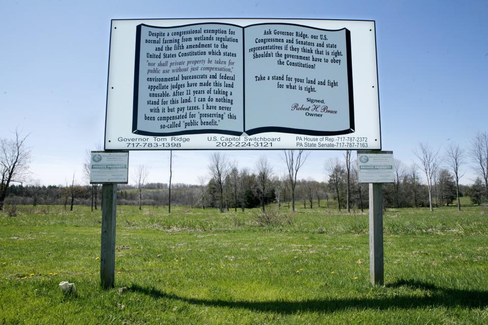 A sign Bob Brace posted at Lane and Greenlee road on his Waterford Township farm detailed his complaints against the government.