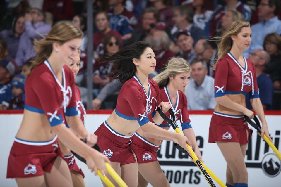 <p>Members of the Colorado Avalanche ice girls clear the ice against the Minnesota Wild at the Pepsi Center on October 8, 2015 in Denver, Colorado. (Photo by Michael Martin/NHLI via Getty Images) </p>