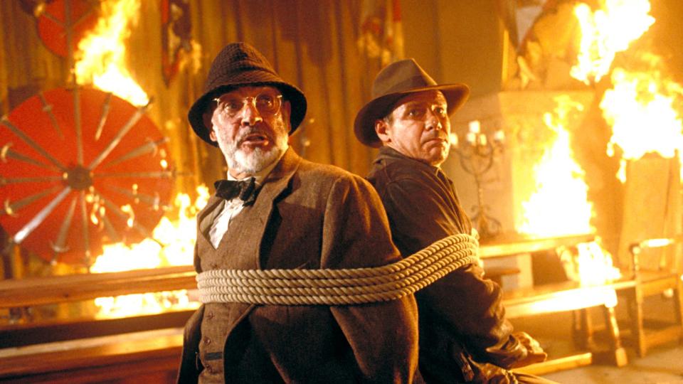 Sean Connery and Harrison Ford are tied up in a fiery room in Indiana Jones and the Last Crusade