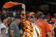 A Houston Astros fan cheers during the seventh inning in Game 6 of the baseball team's American League Championship Series against the Boston Red Sox on Friday, Oct. 22, 2021, in Houston. (AP Photo/Tony Gutierrez)