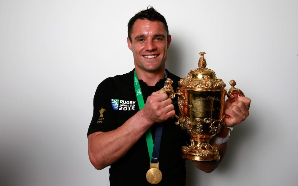 Dan Carter of New Zealand poses with the Webb Ellis Cup - GETTY IMAGES