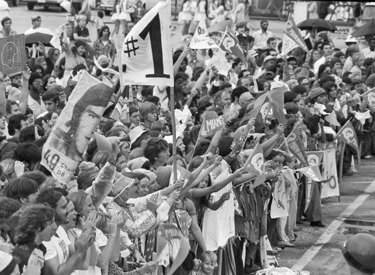 Dolphins fans welcomed home their team after Miami completed a back-to-back Super Bowl run. (AP)