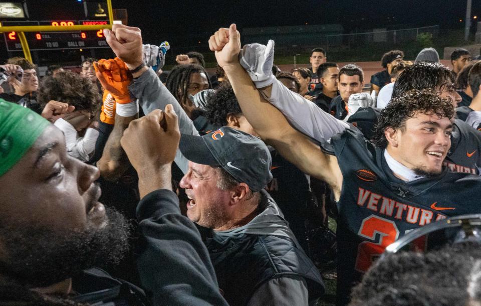 Ventura College head coach Steve Mooshagian celebrates with his team after the Pirates clinched the SCFA Northern Conference with a comeback win over El Camino College on Saturday at the VC Sportplex.