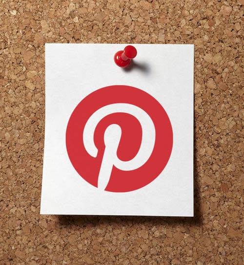 Pinterest logo pinned to bulletin board