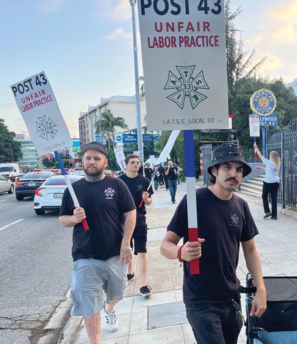 IATSE, which represents projectionists, picketed the theater for failing to meet union demands.