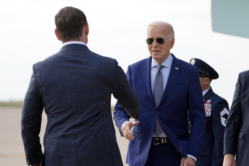 President Joe Biden greets Dallas County judge Clay Jenkins as he arrives on Air Force One Wednesday March 20, 2024, at Dallas-Fort Worth International Airport, in Dallas. (AP Photo/Jacquelyn Martin)