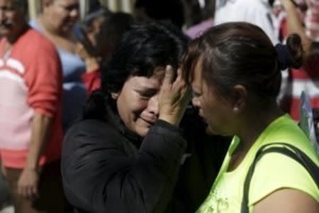 A family member of an inmate reacts while standing with others outside the Topo Chico prison in Monterrey, Mexico, February 11, 2016. REUTERS/Daniel Becerril