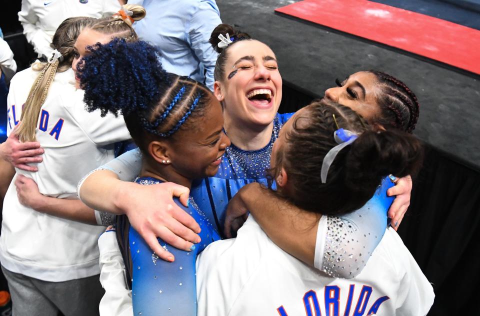 Florida gymnasts celebrate after winning the SEC Gymnastics Championship at Legacy Arena in Birmingham Saturday, March 19, 2022.