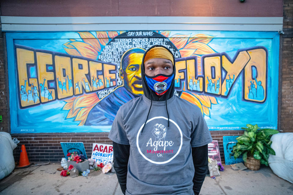 Ijahvonn Waller, 16, stands in front of a mural of Floyd painted on a wall of Cup Foods, near where Floyd died. Waller was preparing to join the members of Agape.<span class="copyright">Ruddy Roye for TIME</span>