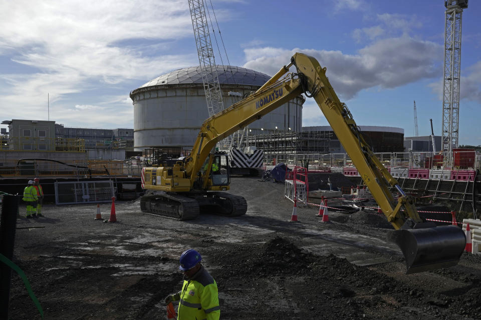 Workers work at the construction site of Hinkley Point C nuclear power station in Somerset, England, Tuesday, Oct. 11, 2022. Sites like the Hinkley Point C nuclear power plant have become integral to the U.K. government’s “net zero” by 2050 strategy. (AP Photo/Kin Cheung)