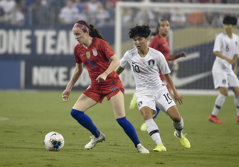 United States' Rose Lavelle (16) battles with South Korea's Ji So-yun (10) for the ball during a soccer match Thursday, Oct. 3, 2019, in Charlotte, N.C. (AP Photo/Mike McCarn)