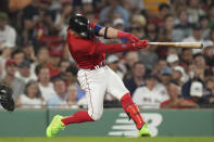 Boston Red Sox's Enrique Hernandez hits a home run against the Cincinnati Reds during the seventh inning of a baseball game Thursday, June 1, 2023, in Boston. (AP Photo/Steven Senne)
