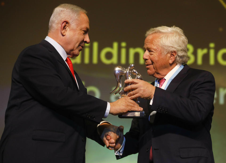 New England Patriots owner Robert Kraft, right, receives Genesis Prize from Israeli Prime Minister Benjamin Netanyahu in Jerusalem, Thursday, June 20, 2019. Israel honored Kraft with the 2019 Genesis Prize for his philanthropy and commitment to combatting anti-Semitism. (AP Photo/Sebastian Scheiner)