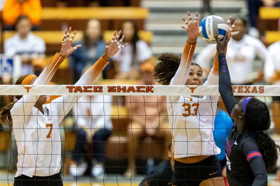 Texas middle blocker Asjia O'Neal, left, and outside hitter Logan Eggleston are key parts to No. 1 Texas' season. The Longhorns swept No. 7 Ohio State last weekend and host No. 4 Minnesota on Wednesday.