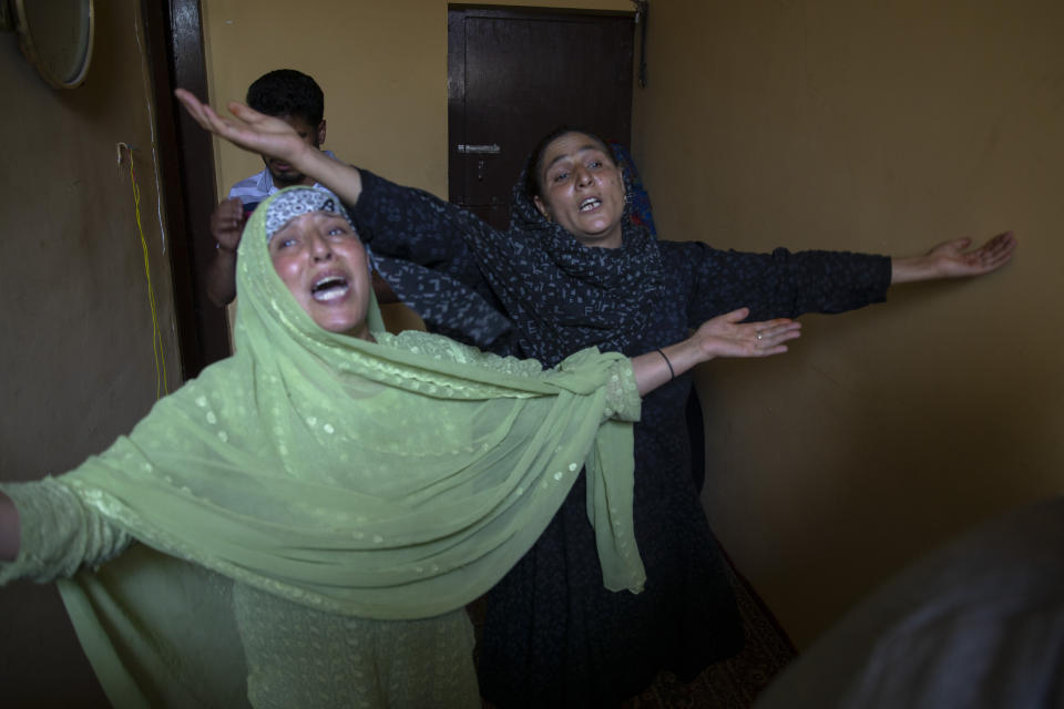 Relatives mourn during the joint funeral of a politician Sheikh Wasim Bari, his father and brother in Bandipora town, north of Srinagar, Indian controlled Kashmir, Thursday, July 9, 2020. Unidentified assailants late Wednesday fatally shot Bari, a leader with Prime Minister Narendra Modi's Bharatiya Janata Party, along with his father and brother in Kashmir, police said, in a first major attack against India’s ruling party members in the disputed region. (AP Photo/ Dar Yasin)