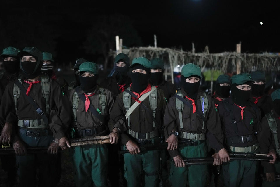 Members of the Zapatista National Liberation Army, EZLN, attend an event marking the 30th anniversary of the Zapatista uprising in Dolores Hidalgo, Chiapas, Mexico, Sunday, Dec. 31, 2023. (AP Photo/Eduardo Verdugo)