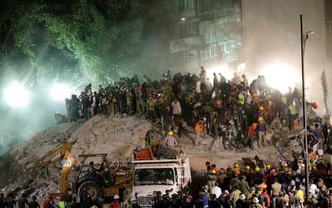 Rescue Services search for victims under the debris - Credit: EPA/Jose Mendez