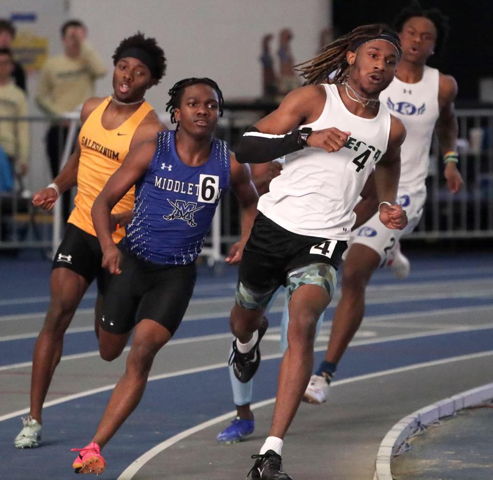 Salesianum's Bishop Lane (left) runs behind eventual second-place finisher Jayden Feaster of Middletown (center) and Odessa's Jordan Hollis (fifth place) before Lane won the 400 meter dash during the DIAA indoor track and field championships at the Prince George's Sports and Learning Complex in Landover, Md., Saturday, Feb. 3, 2024.