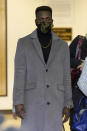 Abimbola "Able" Osundairo, walks through the lobby of the Leighton Criminal Courthouse courtroom during a lunch break in the trial of actor Jussie Smollett Wednesday, Dec. 1, 2021, in Chicago. Osundairo is expected to testify in the trial of Smollett who is accused of lying to police when he reported he was the victim of a racist, anti-gay attack in downtown Chicago nearly three years ago, in Chicago. (AP Photo/Charles Rex Arbogast)