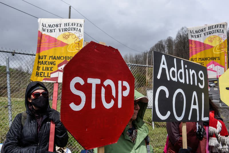 FILE PHOTO: People protest against Senator Manchin in West Virginia