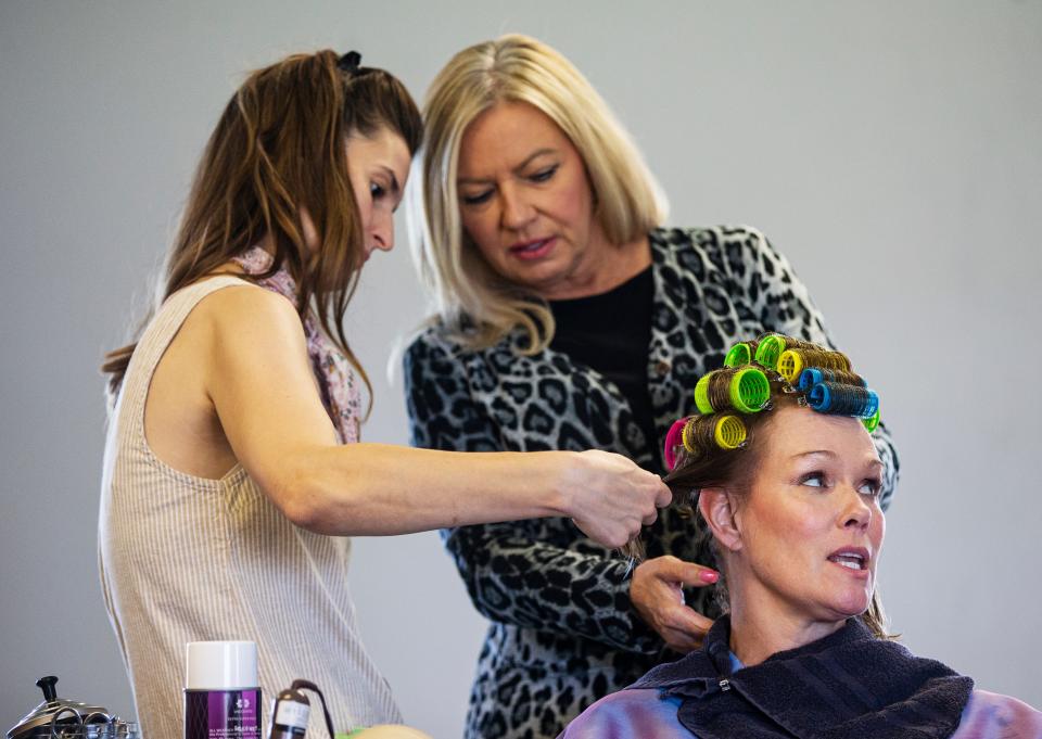 Paula Fitzpatrick, a hairstyling consultant teaches Angie Janas, left, how to use curlers during a session with the acting crew of a production of Steel Magnolias on Saturday, Oct. 22, 2022 at Fleischmann Park in Naples. They are doing the hair of Beth Hylton who plays MÕLynn. Janas plays the part of Anelle. The production will take place at the Norris Community Center.  