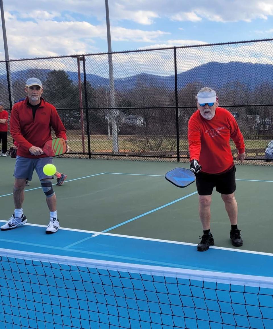 One tennis court can house two pickleball courts, typically with four players a side.