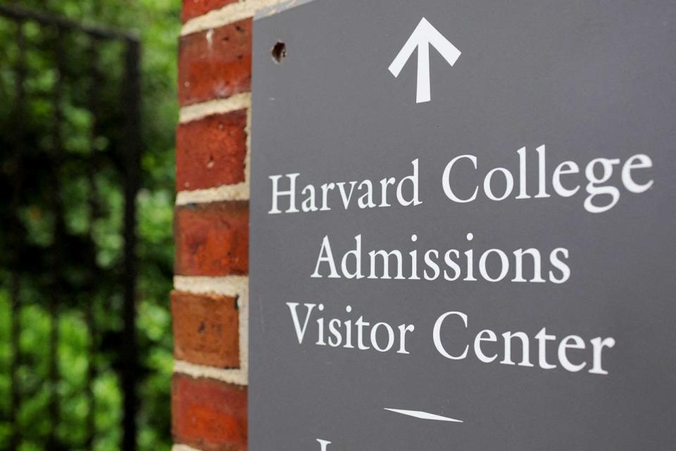 PHOTO: A sign points the way to the Harvard College Admissions Visitors Center at Harvard University in Cambridge, Mass., July 6, 2023. (Brian Snyder/Reuters, FILE)