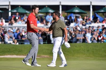 Jan 29, 2017; La Jolla, CA, USA; Jon Rahm and JJ Spaun shake hands following the final round of the Farmers Insurance Open golf tournament at Torrey Pines Municipal Golf Course - South Co. Mandatory Credit: Orlando Ramirez-USA TODAY Sports