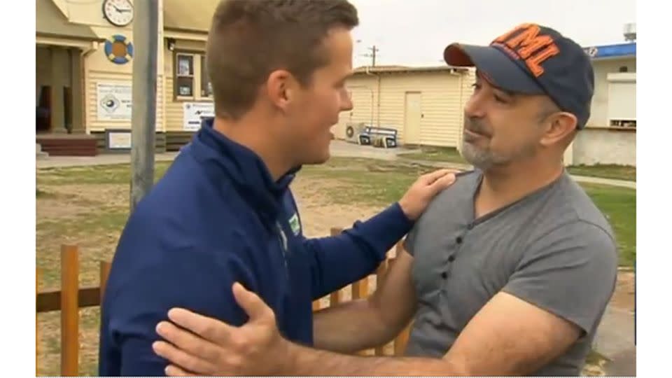 Mr Stevens, right, was emotional when he was reunited with Ben Robertson, left, who saved his and his son's lives on Friday. Photo: 7 News