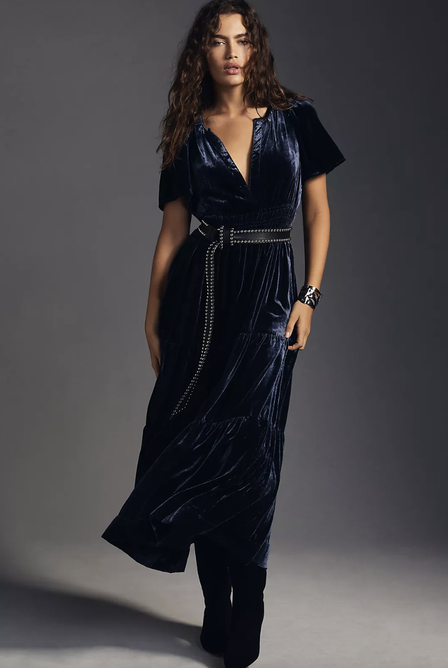 brunette model wearing The Somerset Maxi Dress: Velvet Edition in navy (Photo via Anthropologie)