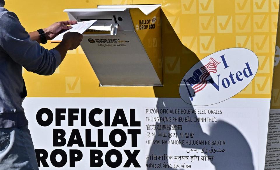 PHOTO: A man drops his ballot into a ballot box at the Orange County Registrar in Santa Ana, Calif., 'Super Tuesday,' March 5, 2024.  (Frederic J. Brown/AFP via Getty Images)