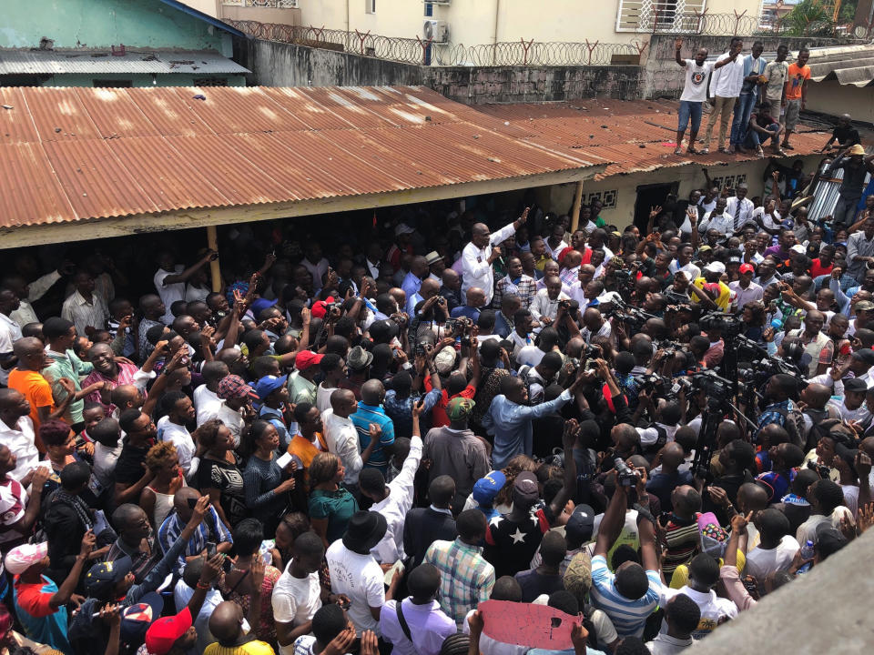 Supporters of spurned Congo opposition candidate Martin Fayulu gather to hear him speak, in Kinshasha, Friday, Jan. 11, 2019. Hundreds gathered to denounce what they called “the people’s stolen victory” in the presidential election. (AP Photo/Jerome Delay)