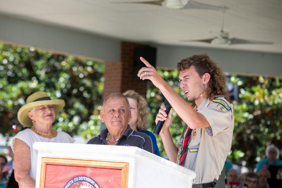 Boy Scout Logan Catalanotto describes his Eagle Scout project on Monday during the Memorial Day Remembrance Ceremony at the Ocala-Marion County Veterans Memorial Park in Ocala. Catalanotto, who celebrated his 18th birthday on Monday, led a team that redid the flag pavilion at the park.