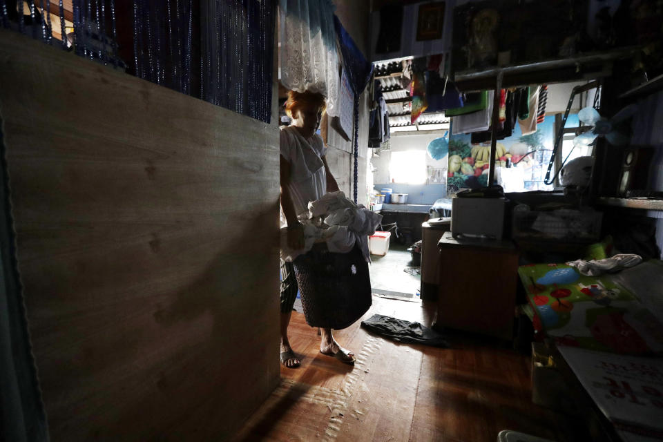 A woman prepares to wash laundry which has piled up after several days without water at her home in Mandaluyong, metropolitan Manila, Philippines on Thursday, March 14, 2019. Aside from the daily line of residents waiting for water rations from trucks, many businesses like laundry shops, carwash and water-purifying stations in Manila have been affected by a water shortage from the Manila Water Company due to low levels at the La Mesa dam and the onset of El Nino which causes below normal rainfall conditions. (AP Photo/Aaron Favila)