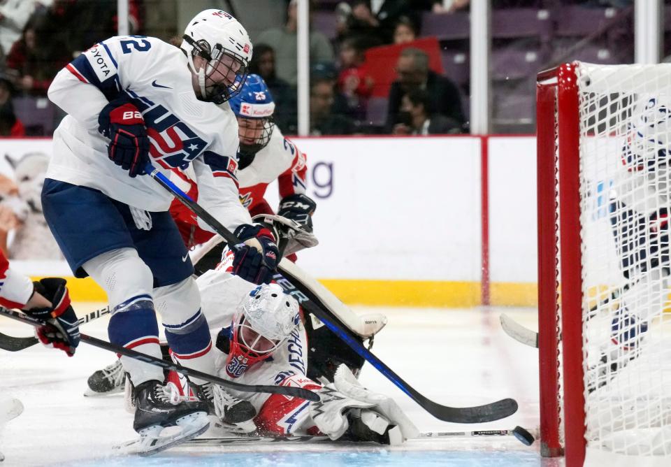 United States forward Tessa Janecke (22) scores past Czech Republic goaltender Katerina Zechovska (30) during the third period in the semifinals of the women's world hockey championships in Brampton, Ontario, Saturday, April 15, 2023. The Orangeville native had two goals in the game. (Nathan Denette/The Canadian Press via AP)