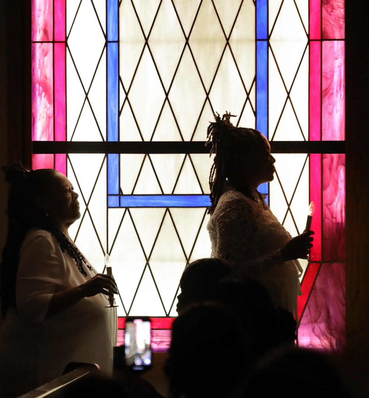 Dozens of women dressed in white process into the sanctuary at Second Baptist Church in Alliance for the 26th Women in White Concert on Sunday, March 17, 2024.