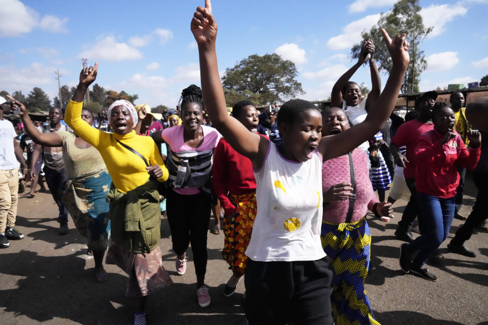 Supporters of Zimbabwe's main opposition leader, Nelson Chamisa march on the streets during a voter registration and inspection exercise in Harare on Tuesday, May, 30, 2023. Chamisa described the voters roll as "a perennial challenge" and alleged that irregularities include missing names of registered voters as the country prepares for elections to be held on Aug. 23. (AP Photo/Tsvangirayi Mukwazhi)