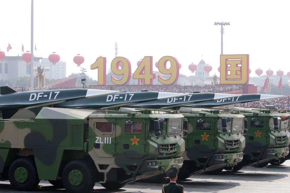 Military vehicles carrying hypersonic missiles DF-17 travel past Tiananmen Square during the military parade marking the 70th founding anniversary of People's Republic of China