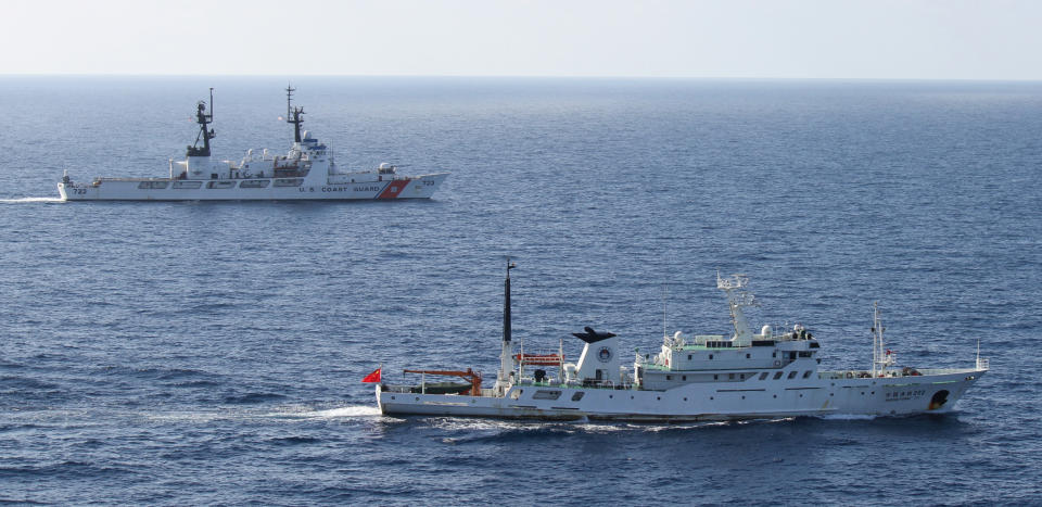 In this photo released by the U.S. Coast Guard, the Coast Guard cutter Rush, top, and a China Fishery Law Enforcement Command vessel, bottom, sail together while their respective crews meet together in order to transfer the custody of the suspected high seas drift net fishing vessel Da Cheng in the North Pacific Ocean Aug. 14, 2012. The U.S. Coast Guard has transferred to China a vessel suspected of illegal high seas driftnet fishing that was pursued by a cutter assigned to Alaska. Coast Guard officials say the 177-foot Da Cheng seized 850 miles east of Tokyo last week was turned over Tuesday to the China Fishery Law Enforcement Command. The Hawaii-based Coast Guard cutter Rush escorted the stateless vessel. (AP Photo/U.S. Coast Guard)