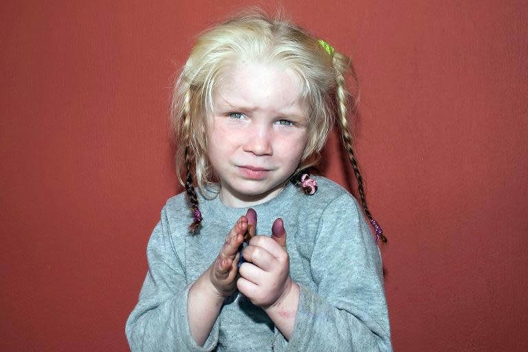 A photo released by Greek police on October 18, 2013 shows an unidentified 4-year-old blonde girl who was found on October 17, 2013 near Farsala in central Greece