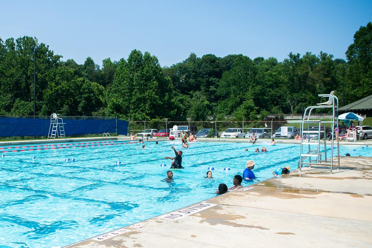 Asheville community members visit the pool at the Recreation Park pool in east Asheville on Thursday, July 29, 2021.